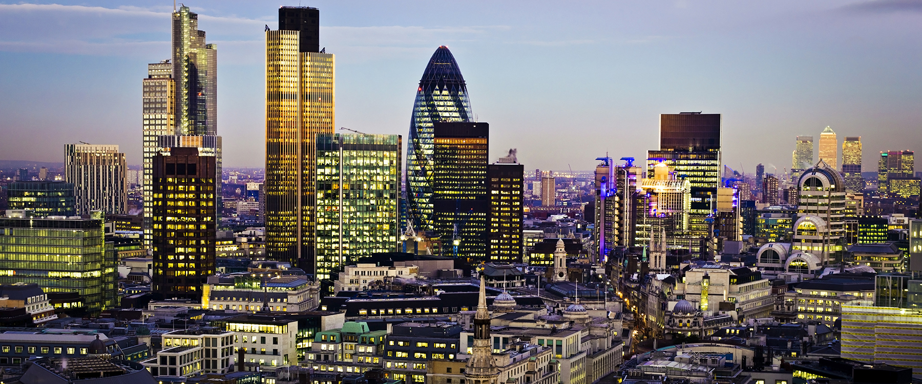 London skyline lit up at night)