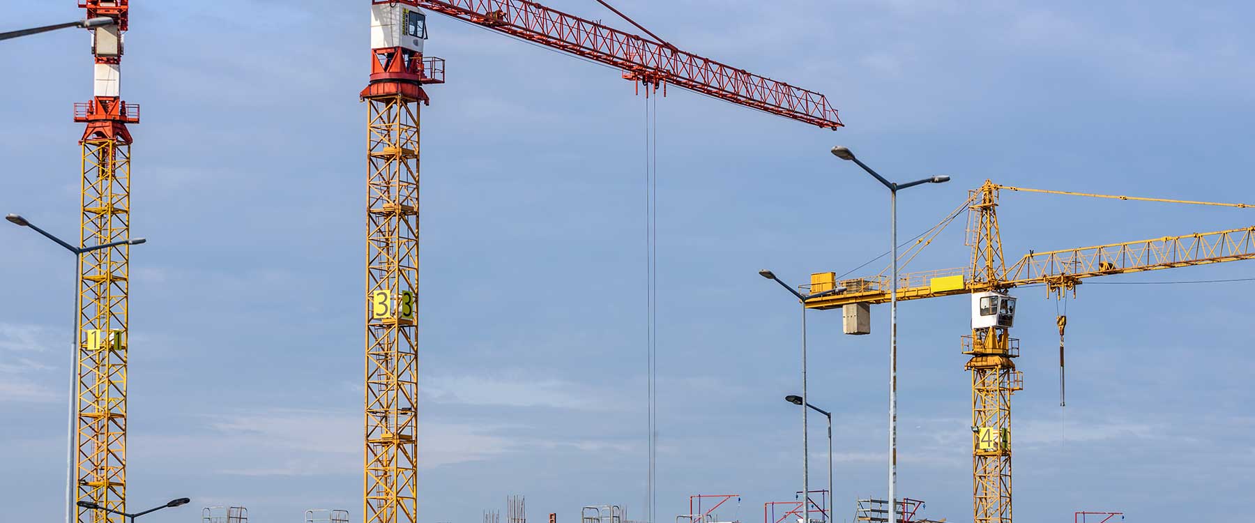 Cranes on a worksite)