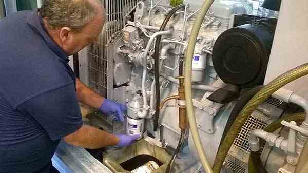 Generator Service Engineer repairing a generator