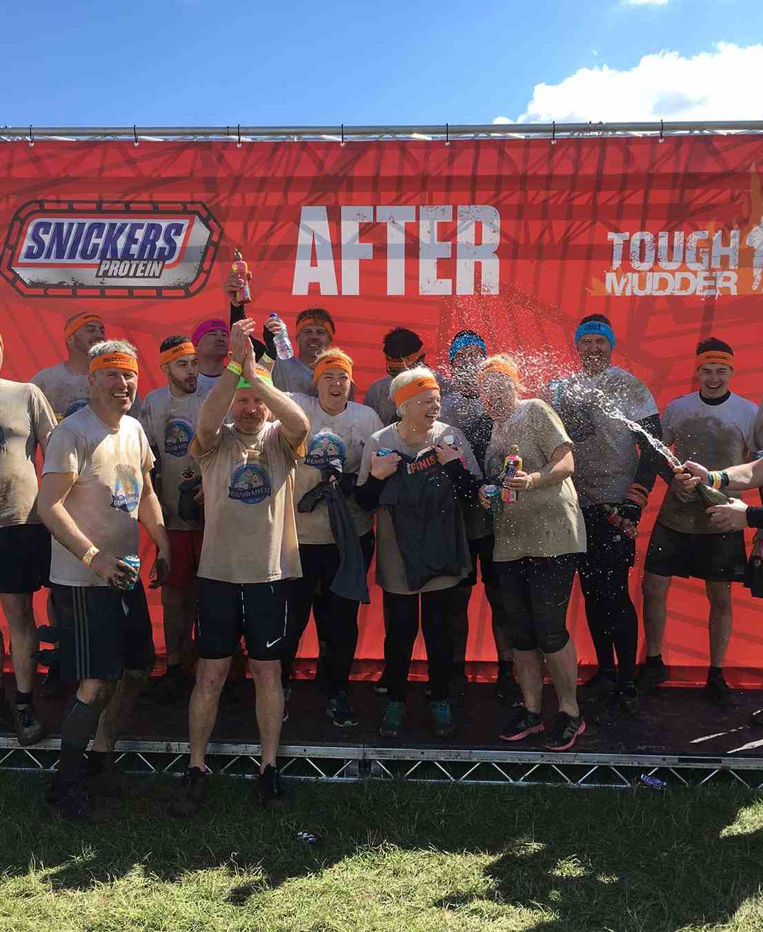 Power Electrics Staff celebrate completing Tough Mudder