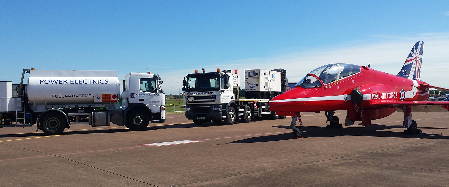 Power Electrics lorry alongside a royal international air tattoo plane)